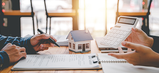 homeowner savings image of two people calculating home savings